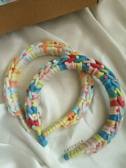 Our Princess Braids Headband in a pastel rainbow color, a comfortable and trendy accessory for your wardrobe.
