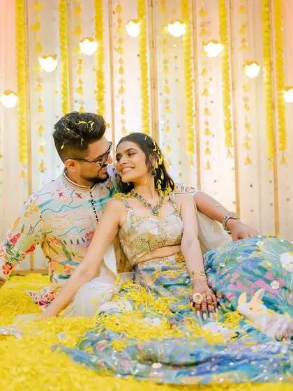 The 'phoolon ki haldi' is a carnival of joy. I love capturing the vibrant colors, the laughter, and the sheer fun of being showered in flowers and love by your favorite people.