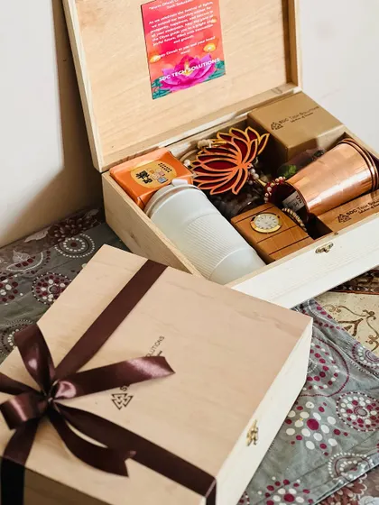 A complete view of the 'SDC Tech Solutions' Diwali gift, showing the open hamper next to a closed, ribbon-wrapped box.
