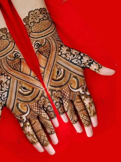 A bold and striking design with prominent peacock motifs and heavy use of dark, filled-in areas for a dramatic effect.