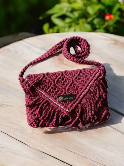 This maroon clutch with a V-shaped fringe is so elegant. It's perfect for a wedding or a formal event.