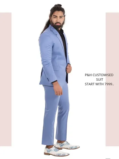 Another side view of the sky blue suit, capturing its vibrant color and modern silhouette.