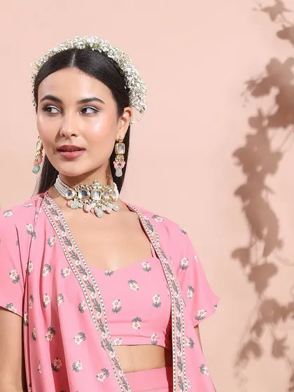 This look features a beautiful pink ethnic co-ord set. I styled it with the same statement jewelry and floral headband to create a cohesive story across different outfits in the collection.