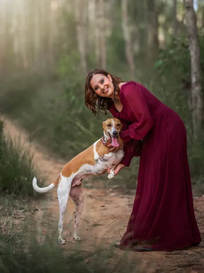 Your four-legged family members are always welcome in my photoshoots. This outdoor portrait captures the pure, joyful connection between a mother-to-be and her beloved dog, creating a memory that includes every member of the growing family.