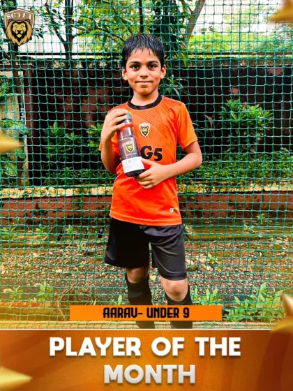 A solo shot of Aarav, our Under 9 Player of the Month, proudly holding his award. We aim to build confidence in our youngest players.