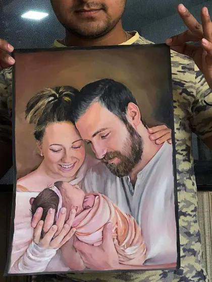 Holding up the finished family portrait for my US client. Seeing the final piece ready to be shipped is always a proud moment.