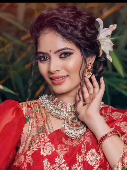 A close-up of a model wearing our grand Kundan and pearl choker. This statement piece is perfect for a reception or grand celebration.