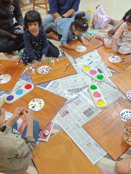 A duplicate of the overhead shot of the engaging dot painting activity.