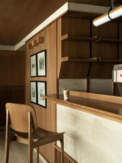 Further images from the BeWell, QBF Coffee, and Tubu projects, illustrating the consistent use of natural materials, clean lines, and thoughtful lighting to create serene and restorative commercial spaces.