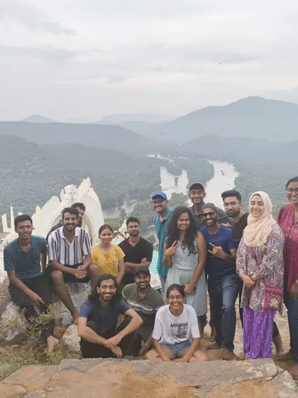 A diverse group of travelers enjoying the view of the river from a hilltop. Everyone is welcome on my adventures.
