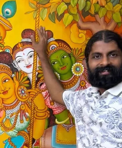 Standing beside my Radhakrishna mural. Sometimes, the art speaks for itself, and I am just the humble instrument. What caption would you give this, my friends?