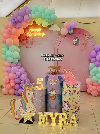 A unicorn theme is always a favorite for kids. I can create a complete magical world with pastel rainbow balloon arches, unicorn cutouts, themed pedestals, and light-up letters for the birthday girl's name.