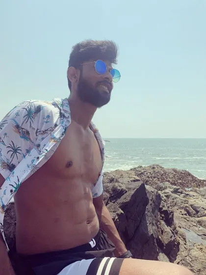 A relaxed, candid shot by the ocean, enjoying the view.