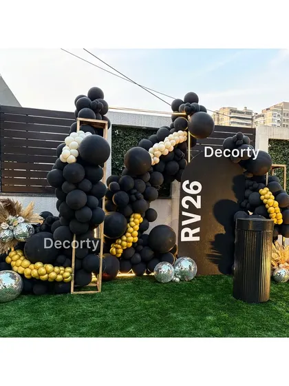 A stylish and modern 'Disco Night' birthday party backdrop for an adult celebration. The design features a bold black balloon arrangement with gold accents and shimmering disco balls for a chic party atmosphere.