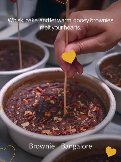 A participant checks if the brownies are perfectly baked. In our brownie workshop, you learn the secrets to achieving that warm, gooey center that everyone loves.