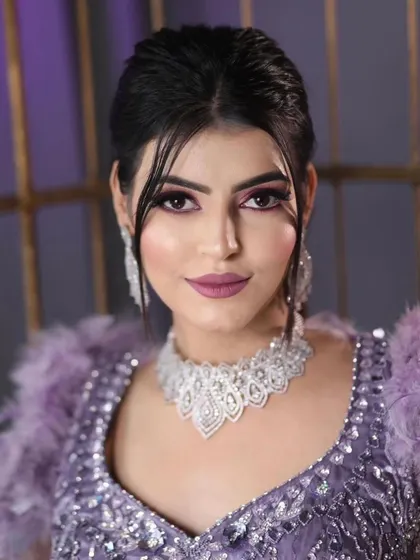 A confident and glamorous shot of the model, showcasing the complete cocktail look that is perfect for a reception or sangeet.