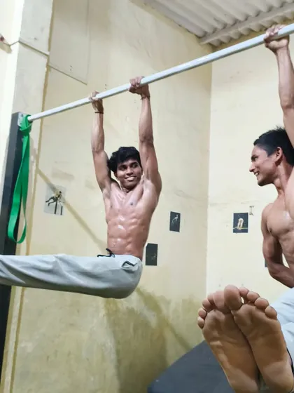 An L-sit hold, a foundational static move that builds incredible core and tricep strength.