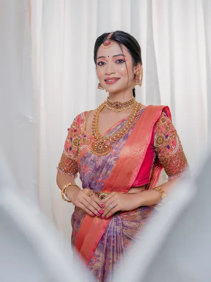 A picture of grace and elegance. This portrait showcases the balanced and natural makeup that complements her features without overpowering them, perfect for the bride who wants to look like herself.