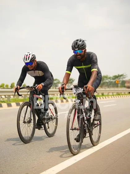 Two riders from the masters category, working together in a breakaway.
