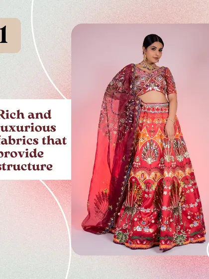 This rich, luxurious red lehenga is a masterpiece. The detailed print and structured fabric make it a regal choice, ideal for a bride or a close family member.