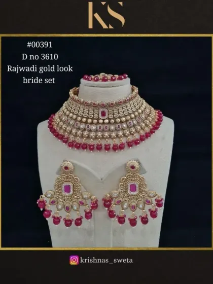 This Rajwadi bridal set is available in a classic ruby red, perfect for a traditional wedding ceremony.