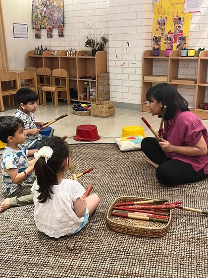 Following a beat with rhythm sticks is a playful way to develop listening skills, teamwork, and hand-eye coordination. These group music sessions are a core part of our movement exploration programs.