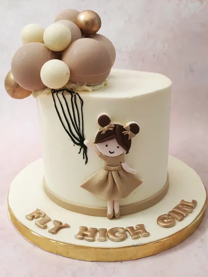We encourage you to "Fly High Girl" with this inspirational and sweet birthday cake. A fondant girl holds a bouquet of neutral-toned balloons, creating a charming and motivational message for a special young lady.