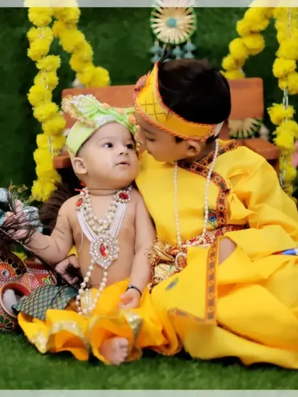A tender kiss between brothers during their Krishna and Balarama themed photoshoot. Capturing sibling love is one of our specialties.
