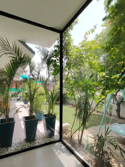 This corner of our own office is designed to bring the outside in. The floor to ceiling glass offers an uninterrupted view of the garden, creating a serene and nature infused workspace that fuels our creativity daily.