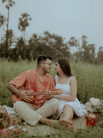 An intimate portrait of the couple, with him serenading her on the guitar.
