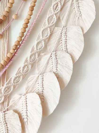 The texture in this piece is just amazing, from the smooth beads to the soft, brushed-out leaves.