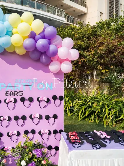 A fun party favor station offering Mickey and Minnie ears for guests to wear, getting everyone into the Disney spirit.