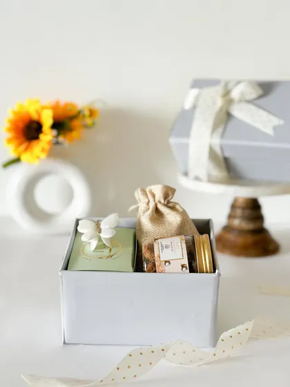A simple yet beautiful gift box for a baby announcement. It contains a curated selection of our treats and is finished with a pretty polka-dot ribbon.
