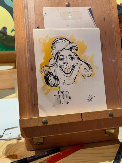 A finished caricature on my easel, ready for its big reveal. I love the anticipation of this moment.