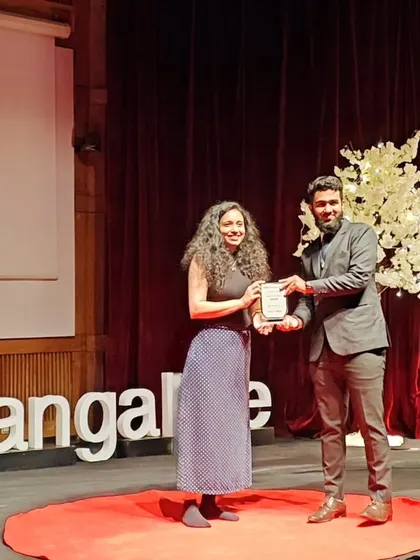 I feel so grateful for this moment, receiving a token of appreciation on the TEDx IIM Bangalore stage. It was an honor to contribute to such an inspiring event filled with eminent speakers and powerful ideas.