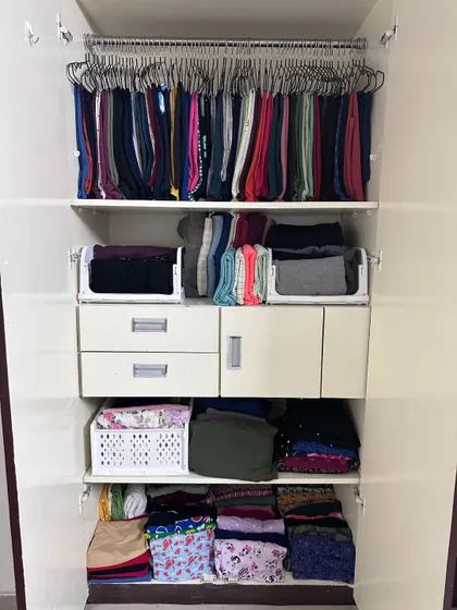 By using a combination of hanging for pants and stackable bins for folded t-shirts, we made sure our client can see and enjoy every single piece of clothing she owns.