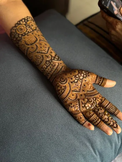 This is a detailed view of my intricate bridal henna work. Each design is unique, combining traditional patterns like paisleys and mandalas with fine-line fillers to create a stunning, full-coverage look for your special day.