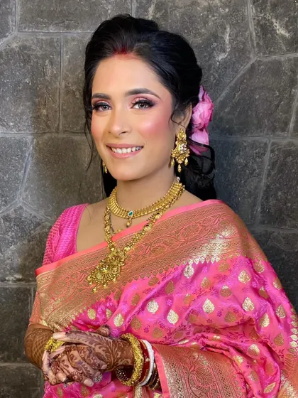 Another beautiful portrait of Shayree, her smile lighting up the frame. The makeup is designed to enhance her natural Bengali features.