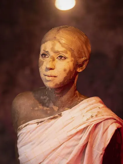 Lit by a single bulb, this image evokes the humble potter's studio in Kumartuli where the divine takes shape. It questions if we raise our women to be as brave as the goddess we worship.