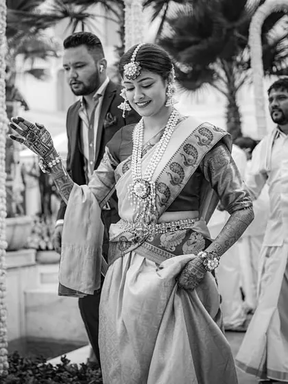 A black and white shot of the bride's entry, capturing a timeless and graceful moment.