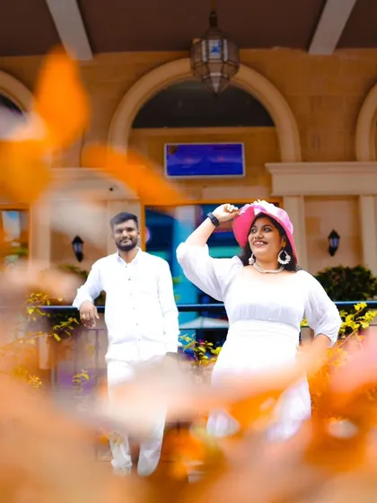 A stylish shot with a pop of color from a pink hat. I love incorporating small props that show off the couple's personality.