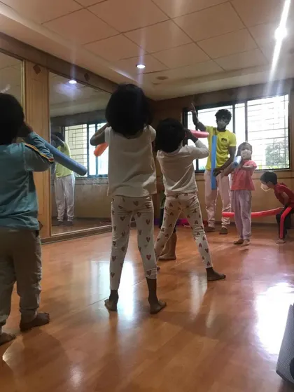 A look at our outdoor program, where we bring "Serious Fun" right to your apartment's doorstep. These images show kids enjoying gymnastics and yoga on mats in both indoor and outdoor community spaces.