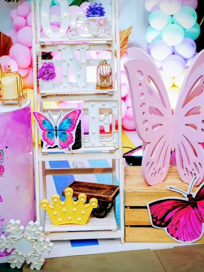 A decorative shelf and large butterfly wing prop from another beautiful party.