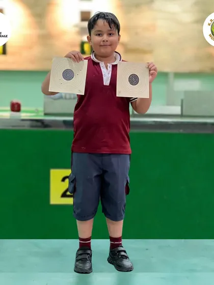 This young shooter is all smiles holding up his targets. Our goal is to make every session a positive and empowering experience.