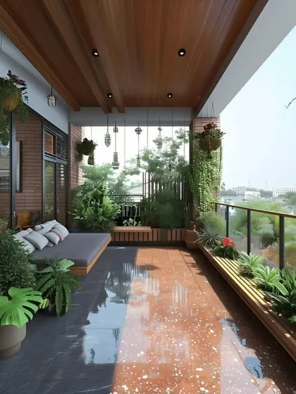 A spacious balcony designed as an open-air lounge. It features a built-in daybed, extensive planters along the railing, and hanging lights, making it perfect for afternoon naps or evening gatherings.