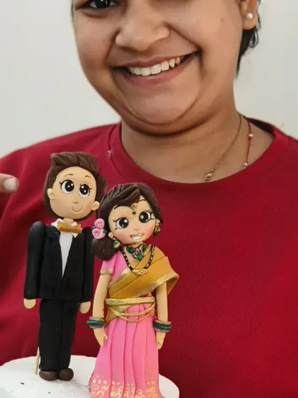 Another happy student with her beautifully crafted bride and groom topper. I make sure every class is hands-on, with personal guidance to help each student succeed.