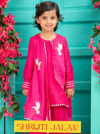 This fuchsia pink kurta set with delicate bird embroidery is one of my favorite designs for Rakhi. It's bright, cheerful, and celebrates the joy of the festival in style.