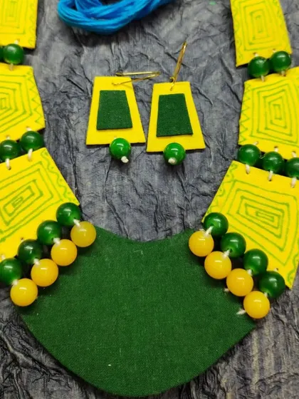 These images showcase the wide variety of my fabric jewelry collection, including different prints, paintings, and color combinations, all available for wholesale.