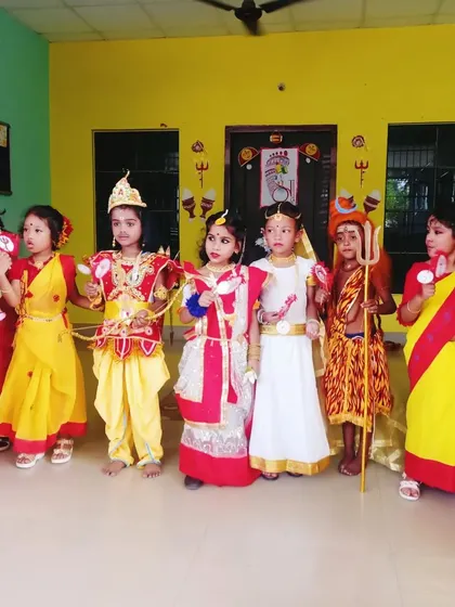 A lineup of students in various mythological costumes, ready for their school performance. You can see the variety I offer, from sarees to dhotis and character-specific outfits.