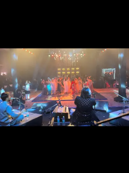 A view from my seat on stage, looking out at a sea of guests dancing. This is a memory of a night where the music truly brought everyone together.